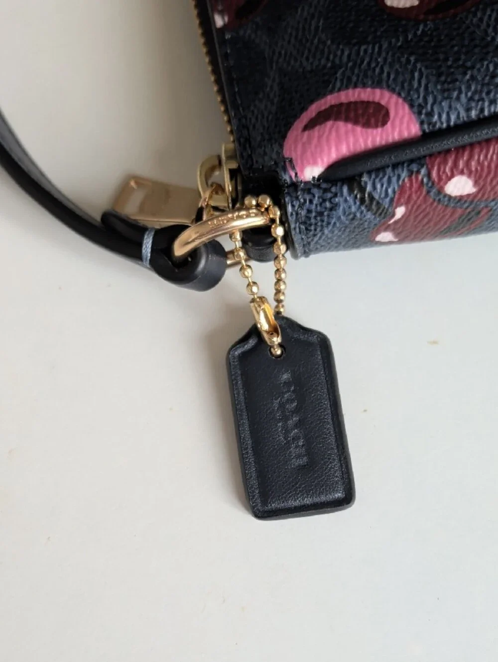 Coach Black Cherry Print Wristlet with Pink Accents